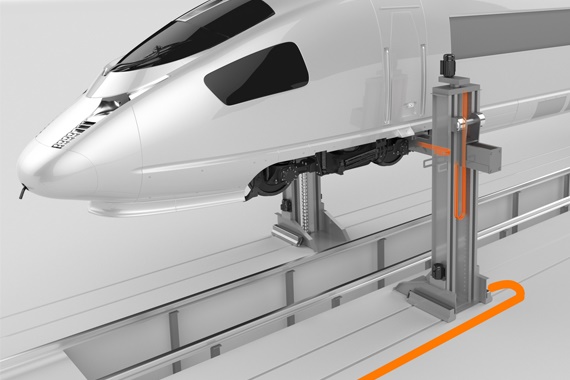 Plataforma elevatória para comboios com calhas articuladas e cabos chainflex
